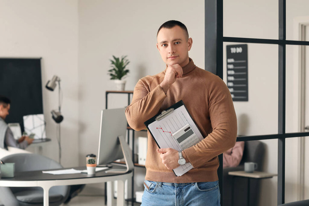 Portrait of male accountant in office - Foto, imagen