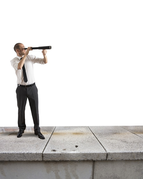 Businessman looks in binocular - Photo, Image
