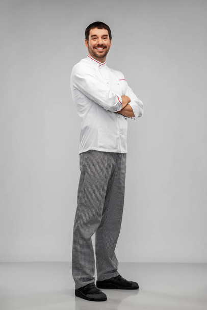 happy smiling male chef in jacket - 写真・画像