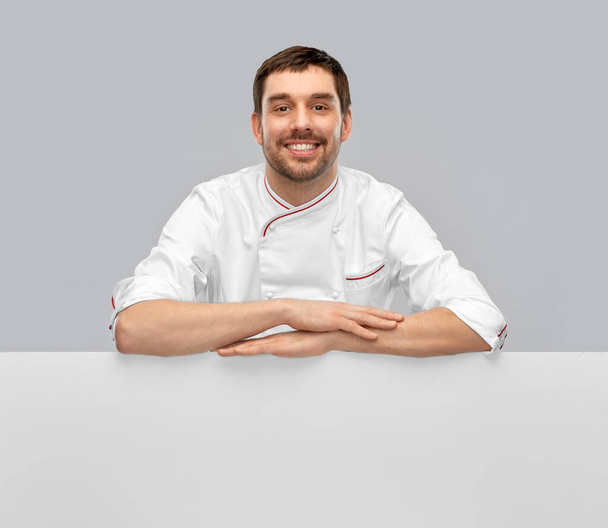 happy smiling male chef with big white board - Zdjęcie, obraz