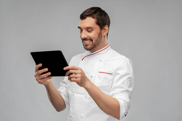 happy smiling male chef with tablet pc computer - Zdjęcie, obraz