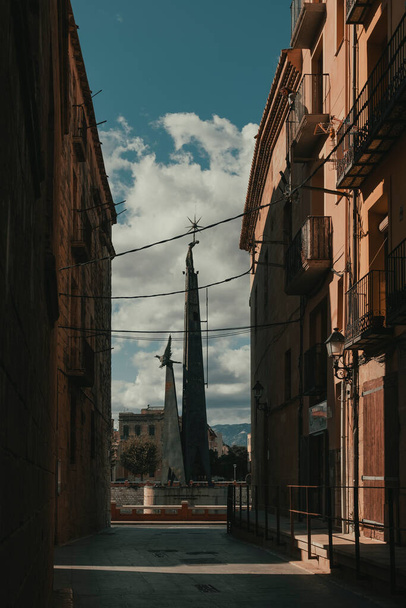 Tortosa, Spain-October 12, 2020: At the end of a street in the old town of Tortosa you can see the Francoist monument to those who died in the Battle of the Ebro. This monument will be removed next July in compliance with the Law of Historical Memory - Foto, immagini