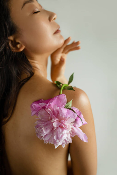 Skin care concept. Close Up Young Asian Woman Touching Perfect Smooth Body Skin - Photo, Image