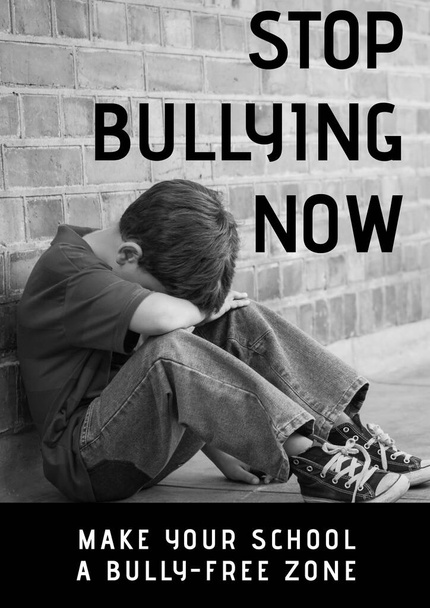 Composition of anti bullying text with crying schoolboy in black and white. childhood, bullying and social issues concept digitally generated image. - Photo, image