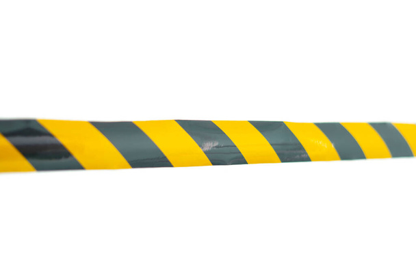 a police caution line area, do not cross, security warning black and yellow tabe - Photo, Image