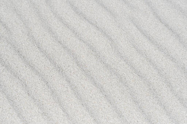 Фоновое фото песка на пляже, текстуры и рисунка с копировальным пространством - Фото, изображение