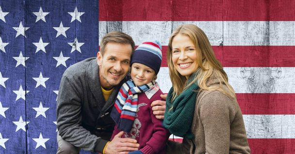 Composition of portrait of smiling caucasian couple with son against american flag. united states of america patriotism and independence concept digitally generated image. - Фото, зображення