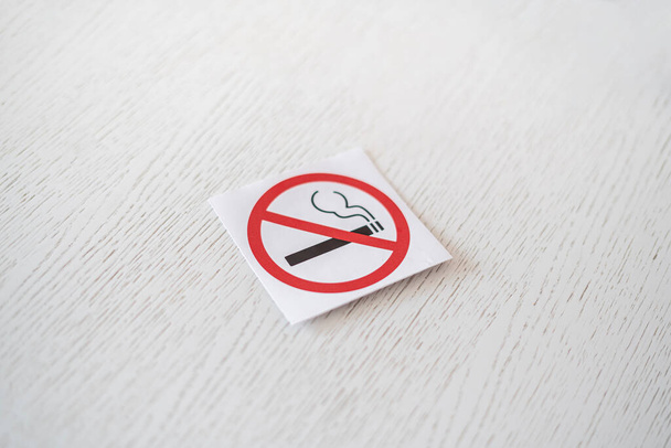 a no smoking restriction sticker symbol area on the wall in public place - Foto, Bild