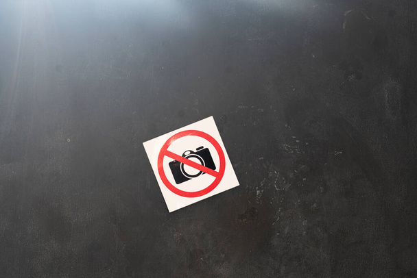 a camera banned symbol icon sticker on the wall in public place, shooting restriction area - Photo, Image