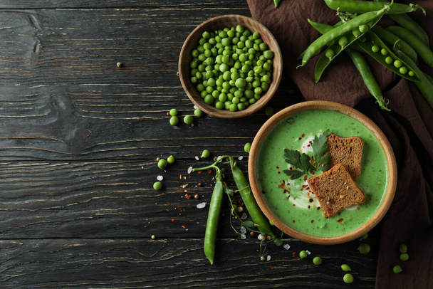 Concept of tasty eating with pea soup on wooden table - Foto, immagini