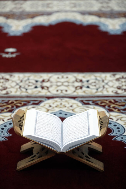 An open Holy Quran on wood stand.  - Fotoğraf, Görsel