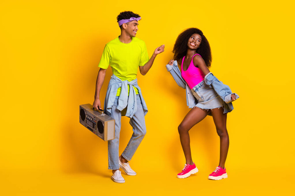 Full length body size view of handsome beautiful cheerful couple dancing having fun pastime isolated on bright yellow color background - Photo, image