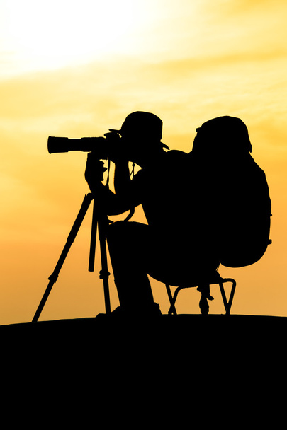 Silhouette of photographer shooting for a sunrise - Zdjęcie, obraz