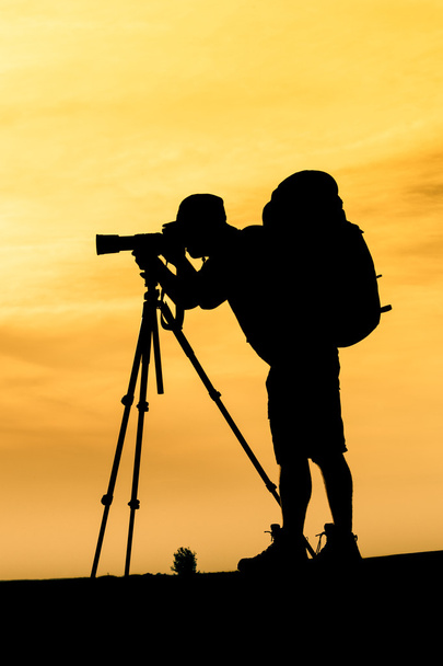Silhouette of photographer shooting for a sunrise - Fotoğraf, Görsel