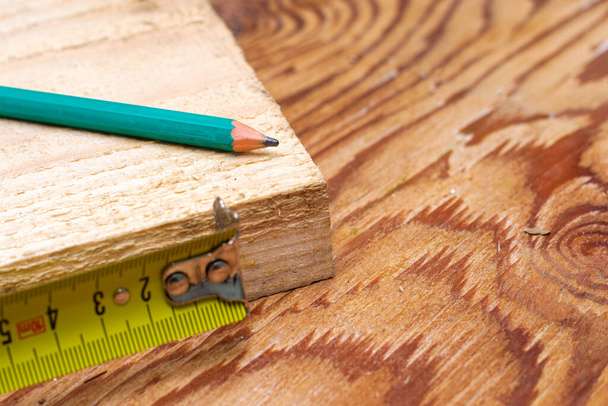 measuring tape pencil and fosca on the workbench concept craft construction. High quality photo - 写真・画像