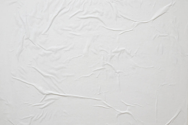 Üres fehér gyűrött és gyűrött papír poszter textúra háttér - Fotó, kép