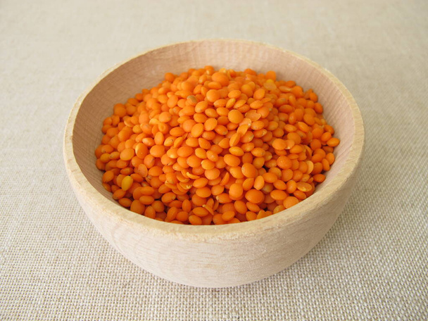 Red lentils in a wooden bowl - Photo, Image