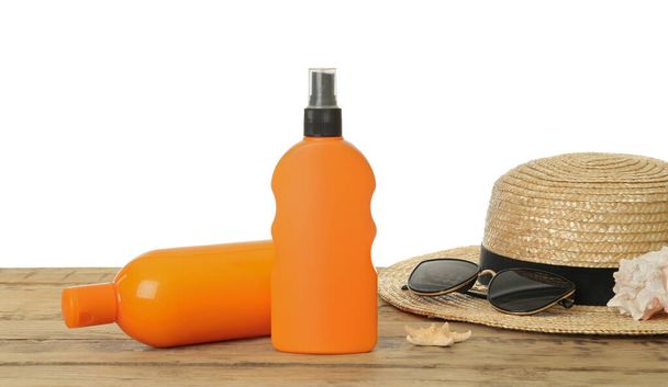 Sun protection products and beach accessories on wooden table - Foto, Imagen