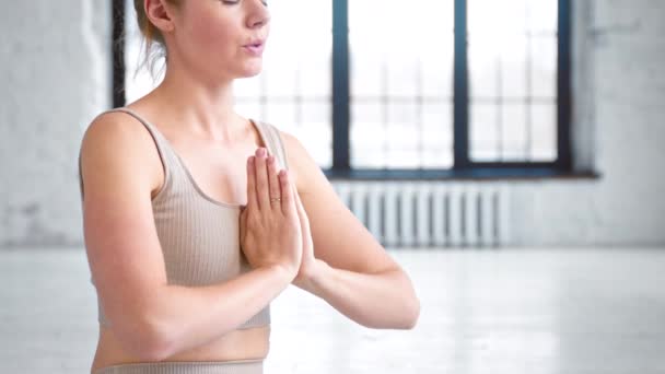 Concentrated lady does breathing gymnastics in studio - Footage, Video