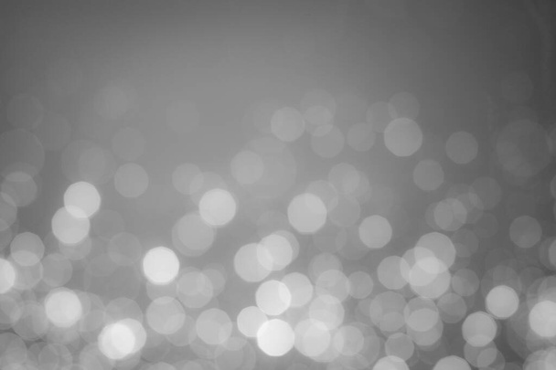 A black-and-white image of bokeh from a blurred lens for the background of your project. - Foto, immagini