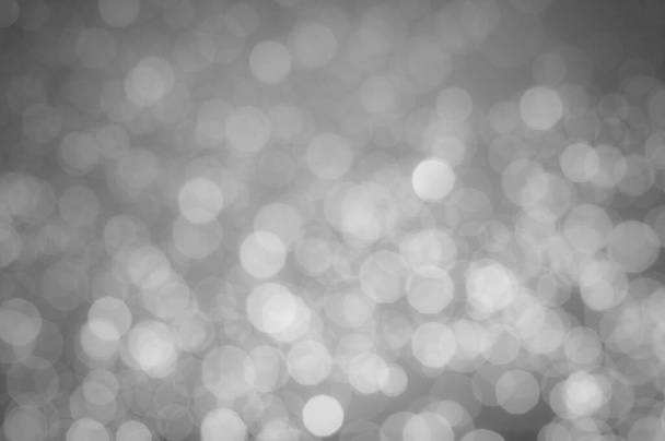 A black-and-white image of bokeh from a blurred lens for the background of your project. - Photo, Image