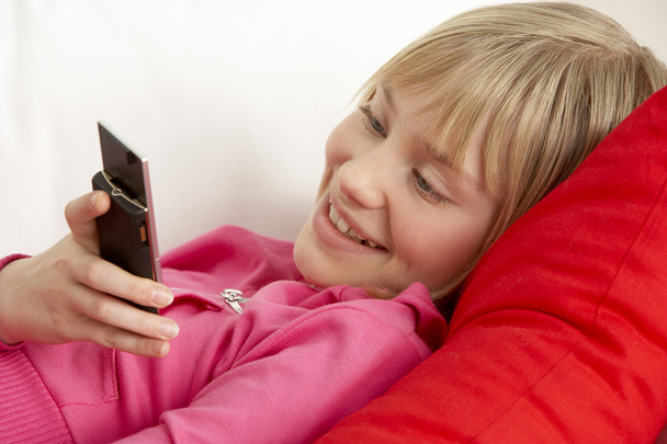 Young Girl Reading Text Message - Foto, Bild