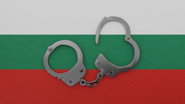 Puolet avattu teräs käsiraudat keskellä ja päälle Bulgarian lippu - Valokuva, kuva