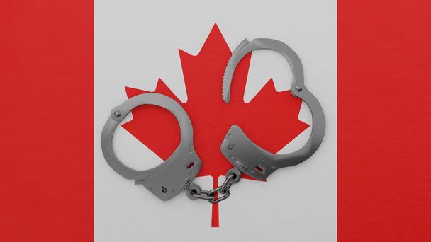 Puolet avattu teräs käsiraudat keskellä ja päälle Kanadan lippu - Valokuva, kuva