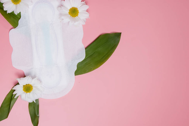 Floral clean sanitary pad, hygiene concept, women products, menstrual pads. - 写真・画像