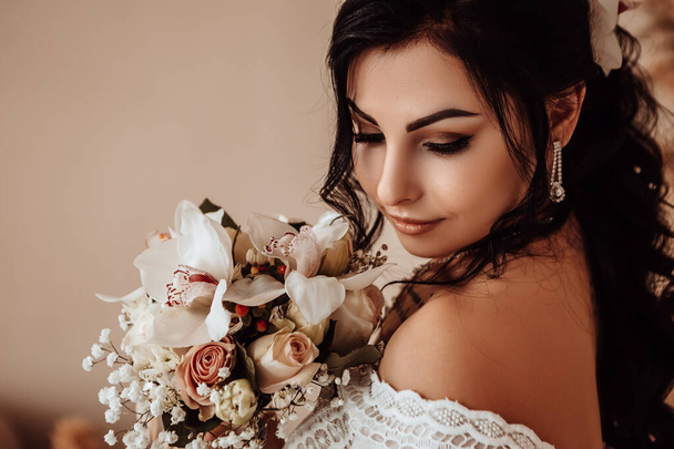 Profile side view female married bride celebrate engagement. Woman dressed white dress hold hand wedding bouquet beautiful flowers. Procreation romantic amazing lady indoor, copy space. - 写真・画像