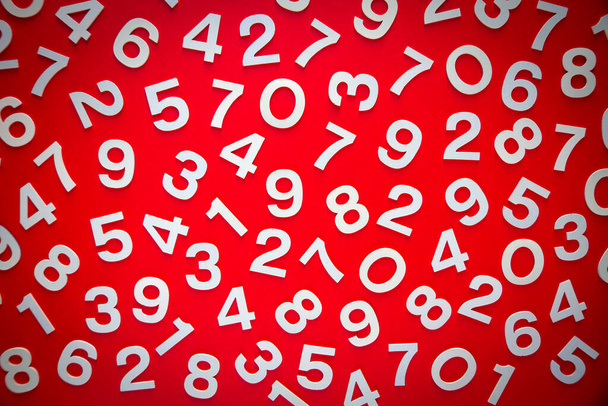 Mathematics background made with solid numbers on a board. Top view, isolated on red - Фото, зображення