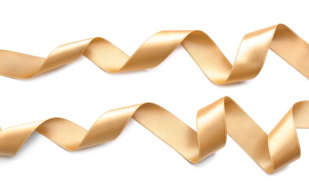 Beautiful golden ribbons on white background - Foto, imagen