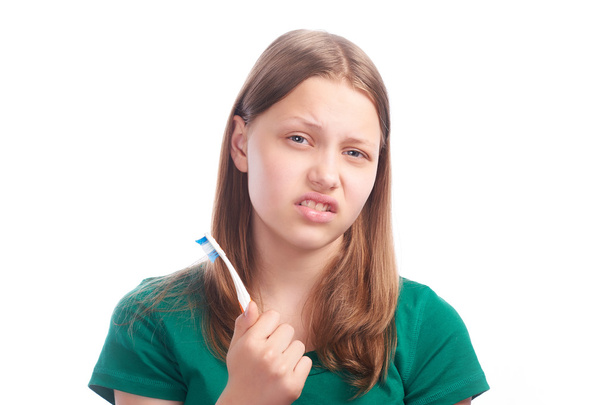 Sad teen girl with toothbrush - Photo, Image