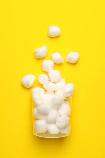 Container with cotton wool on color background - Photo, Image
