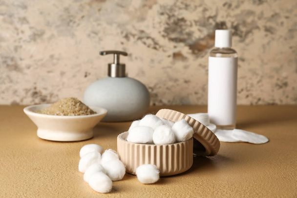 Container with soft cotton wool on table in bathroom - Photo, Image