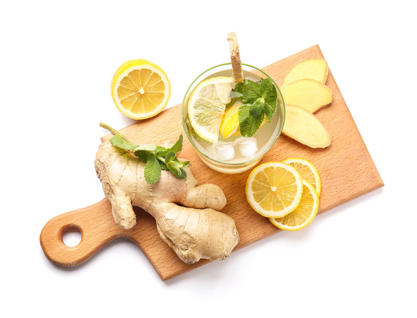Glass of cold ginger lemonade on white background - Valokuva, kuva