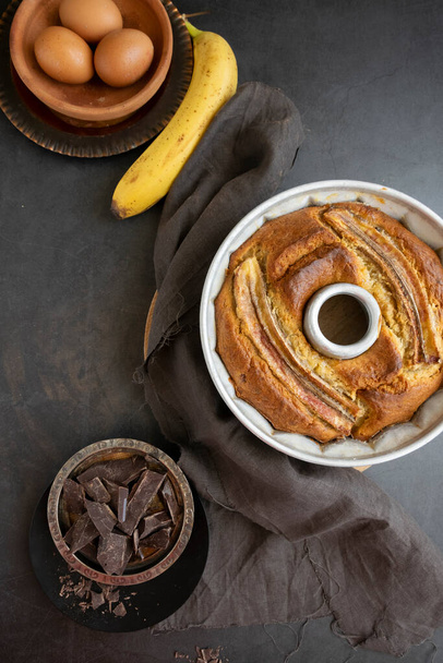 Ready to eat banana bread. Sweet homemade dessert on table, bakery themes - Photo, Image