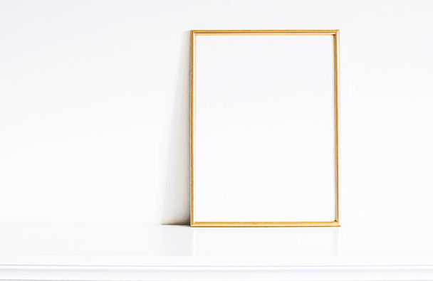 Golden frame on white furniture, luxury home decor and design for mockup, poster print and printable art, online shop showcase - Foto, immagini
