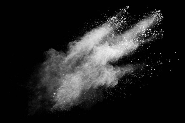White powder explosion cloud against black background.White dust particles splash. - Photo, Image