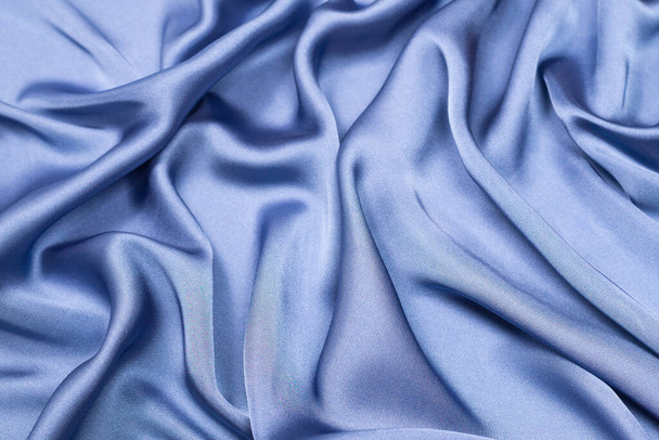Синя шовкова або атласна розкішна тканина. Вид зверху
. - Фото, зображення