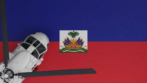 ylhäältä alas näkymä valkoisesta helikopterista vasemmassa alakulmassa ja Haitin kansallisen lipun päällä - Valokuva, kuva