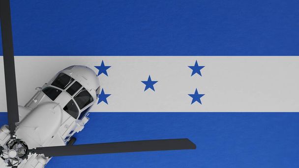 Bovenaanzicht van een witte helikopter in de linkerbenedenhoek en bovenop de nationale vlag van Honduras - Foto, afbeelding