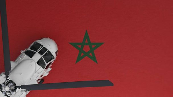 ylhäältä alas näkymä valkoisesta helikopterista vasemmassa alakulmassa ja Marokon kansallisen lipun päällä - Valokuva, kuva