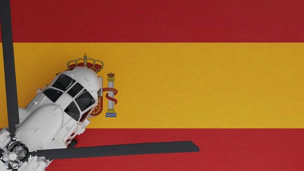Bovenaanzicht van een witte helikopter in de linkerbenedenhoek en bovenop de nationale vlag van Spanje - Foto, afbeelding
