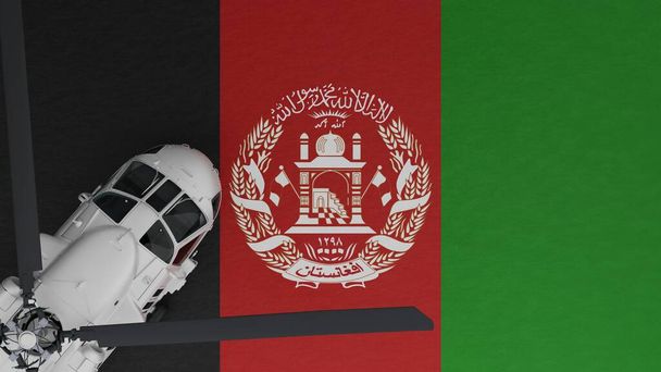 Ylhäältä alas näkymä valkoisesta helikopterista vasemmassa alakulmassa ja Afganistanin kansallisen lipun päällä - Valokuva, kuva