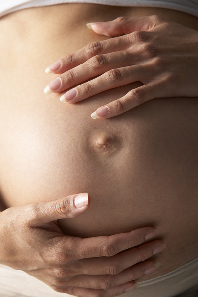 Detail Of Pregnant Woman Holding Stomach - Foto, imagen