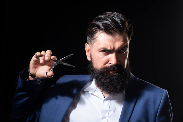 Bearded man, portrait of man with long beard and moustache. Barber scissors for barber shop. Vintage barbershop, shaving. Brutal serious male with modern hairstyle. Vintage barber shop, shaving. - Zdjęcie, obraz