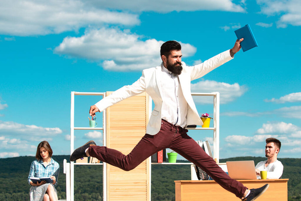 Businessman jump on background of colleagues. Office workers. - Foto, imagen
