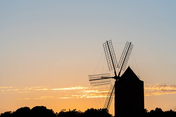 Silhouettes of the mill of Jeroni, Sa Miranda on the island of Formentera in Spain. - Photo, Image