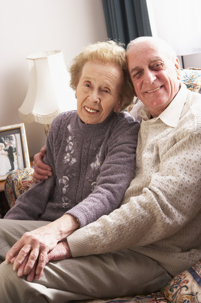 Loving Senior Couple Relaxing At Home - Photo, Image